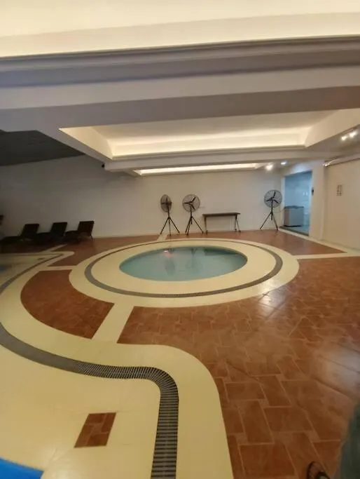 Burgundy Mckinley - Seaside Staycation Manila Apartment